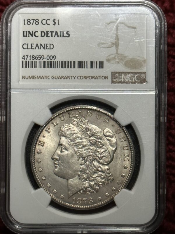 A silver dollar is on display in an ngc holder.