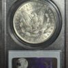 A coin is shown on display in a case.