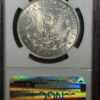 A silver dollar is on display in a case.