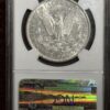 A silver dollar is on display with a card.