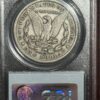 A silver dollar sitting on top of a wooden box.