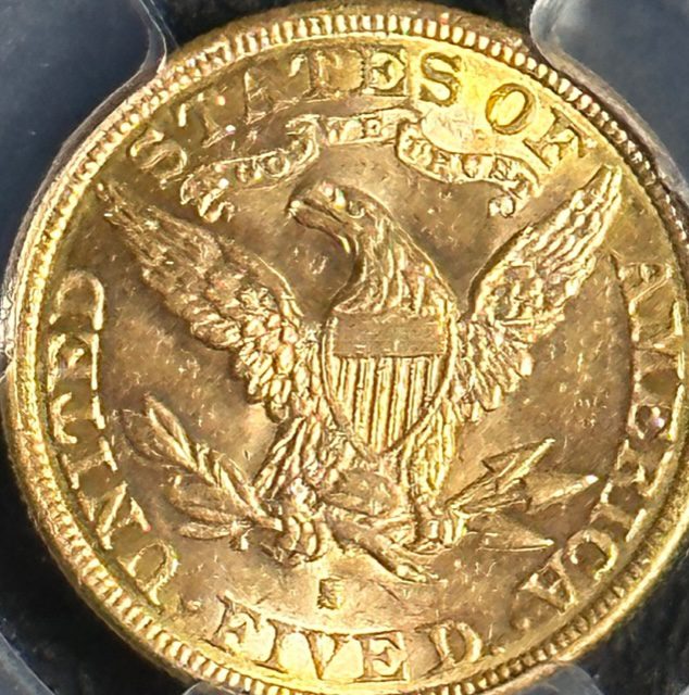 A gold coin with an eagle on it.