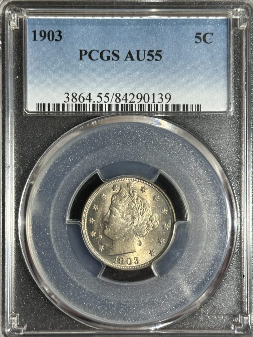 A 1903 Liberty Nickel PCGS AU55 graded coin, displayed in a secure holder with identification numbers.