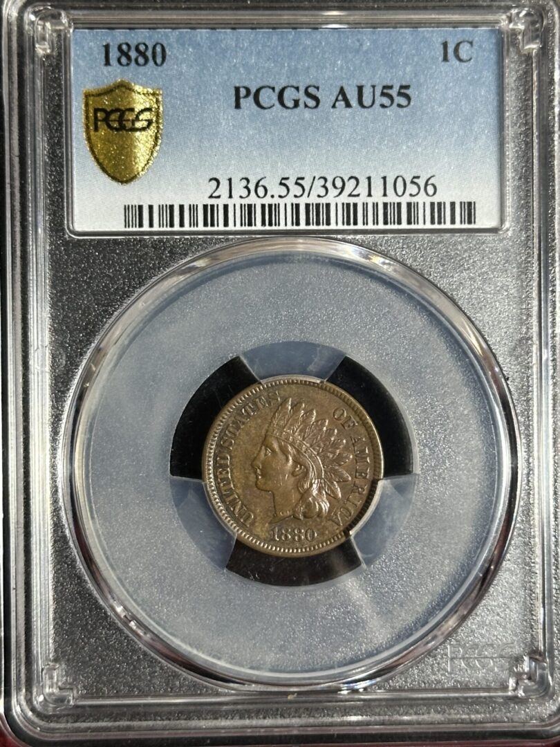 An 1880 Indian Head Cent PCGS AU55 coin, encased in a clear protective holder with identification and grading details above.