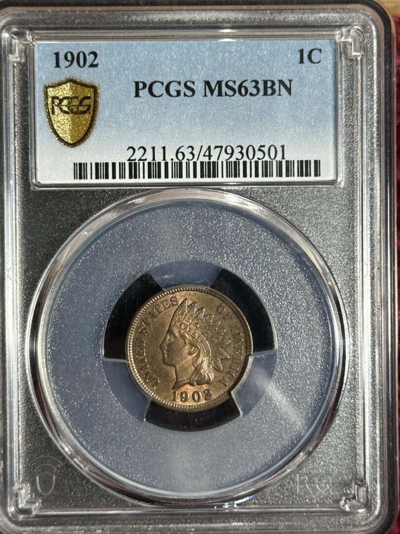 A 1902 Indian Head Cent PCGS MS63 BN in a pcgs ms63bn grading case, labeled with certification details.