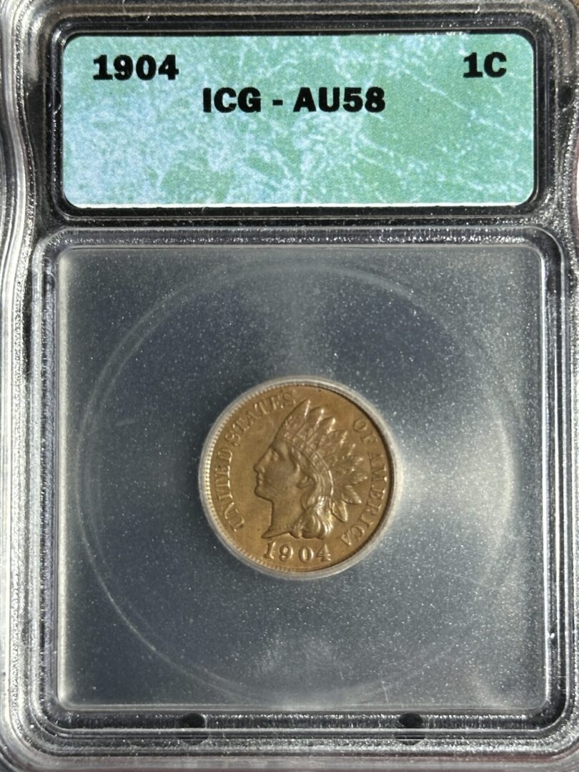 A 1904 Indian Head Cent IGC AU58 featuring a profile relief, graded au58 by icg, encased in a protective plastic slab.