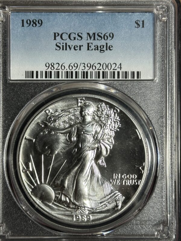 1989 American Silver Eagle PCGS MS69 dollar coin, encased and labeled with certification details; coin features liberty striding forward.