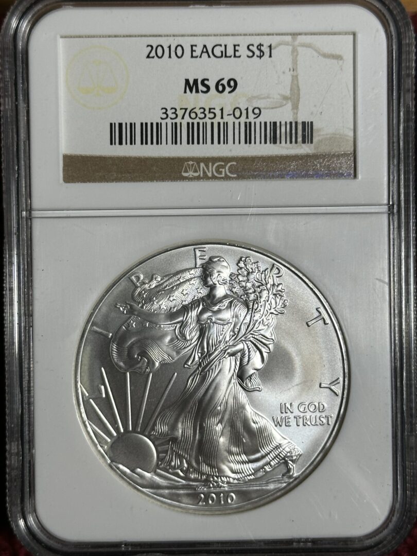 2010 American Silver Eagle NGC MS69 graded, featuring lady liberty holding branches, with "in god we trust" inscribed; sealed in a protective case.