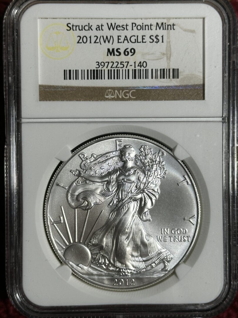 A 2012 American Silver Eagle NGC MS69 featuring the walking liberty design, encased in a protective slab.