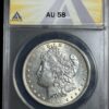 A 1896 Morgan Dollar ANACS AU58 with liberty's profile, encased in a protective anacs holder, displaying condition ratings at the top.