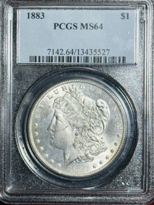 1883 Morgan Dollar PCGS MS64 in a grade case, showing the head of lady liberty and the year on the obverse side.