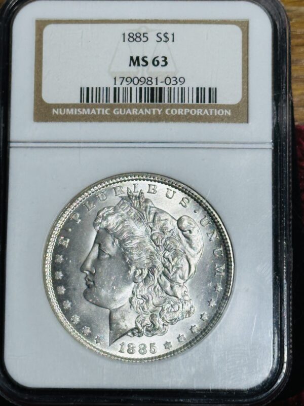 A 1885 Morgan Dollar NGC MS63 graded by numismatic guaranty corporation, encased and displaying the liberty head design.