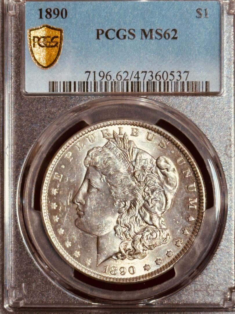 1890 silver dollar graded ms62 by pcgs in a sealed case, displaying the obverse side with liberty's profile.