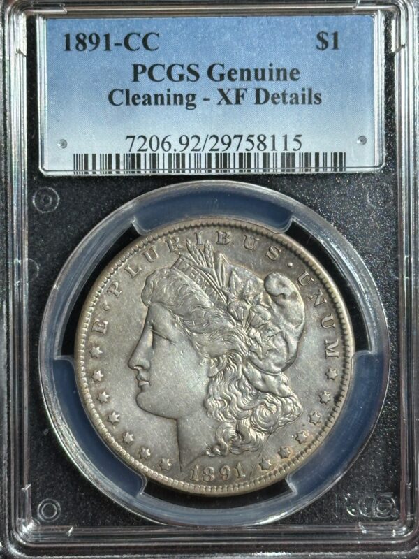 1891-cc morgan silver dollar in a pcgs holder labeled "genuine - cleaning - xf details," showing the coin's obverse with a liberty head design.