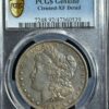 1897-o morgan silver dollar in pcgs holder labeled as genuine with cleaned xf detail, showing the obverse side with liberty's profile and stars.