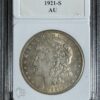 A 1921-s morgan silver dollar encased in a collector's slab, graded au, showing detailed obverse features.