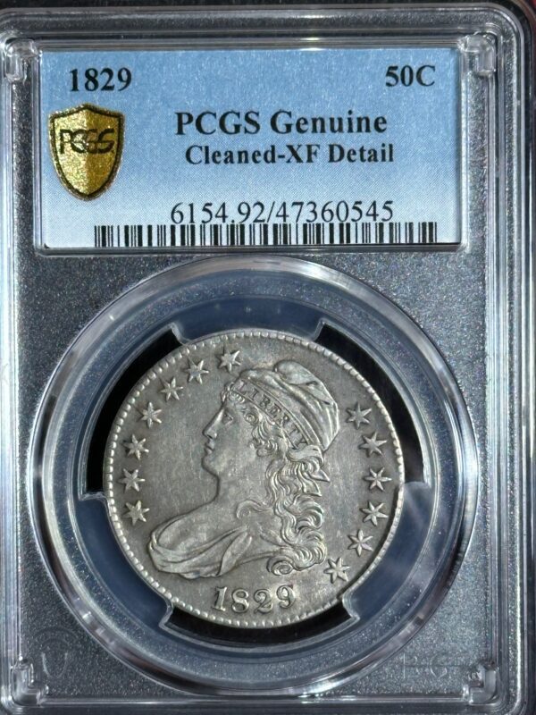 1829 half-dollar coin graded as "genuine cleaned-xf detail" by pcgs, encased in a clear secured holder with certification label.