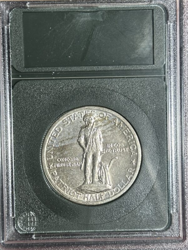 A 1925 Lexington Commemorative AU55 coin encased in a protective holder, showing detailed imagery of lady liberty in stride on the obverse side.