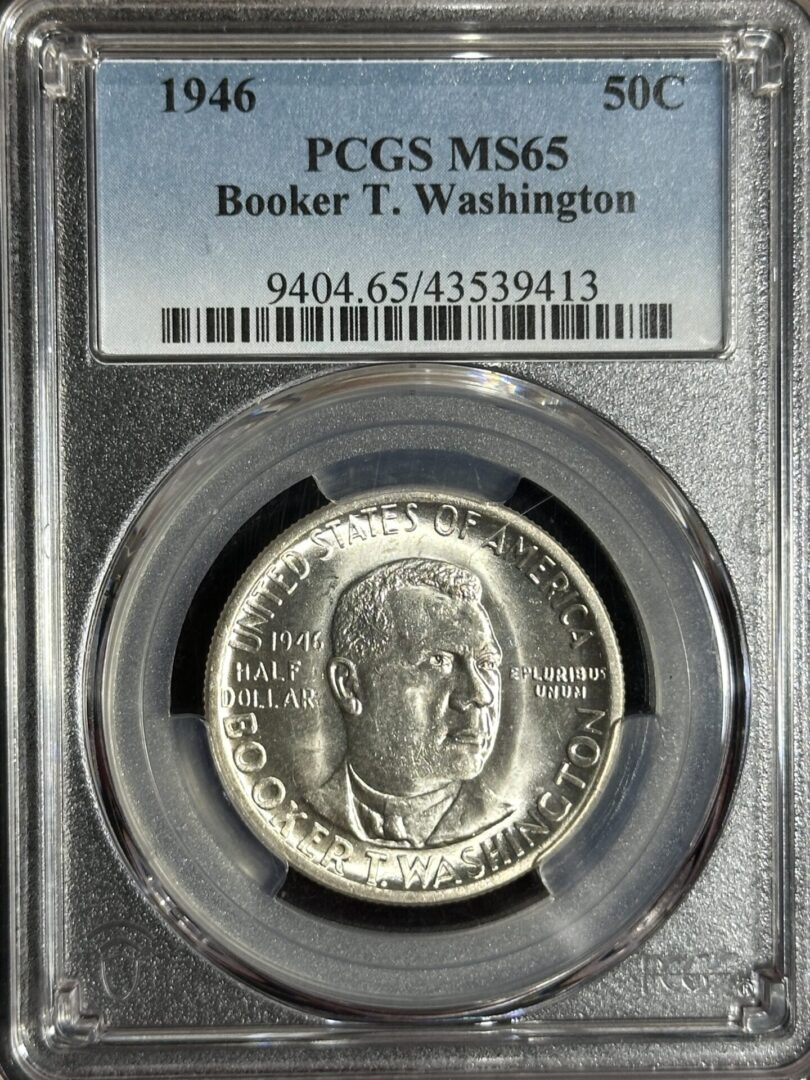 A 1946 Booker T. Washington Commemorative MS65 coin graded by PCGS, displayed in a protective case.