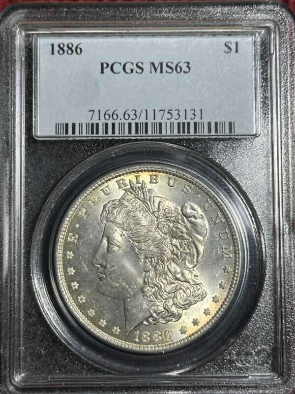 A 1886 Morgan Dollar PCGS MS63 encased in a protective holder with certification details displayed at the top.