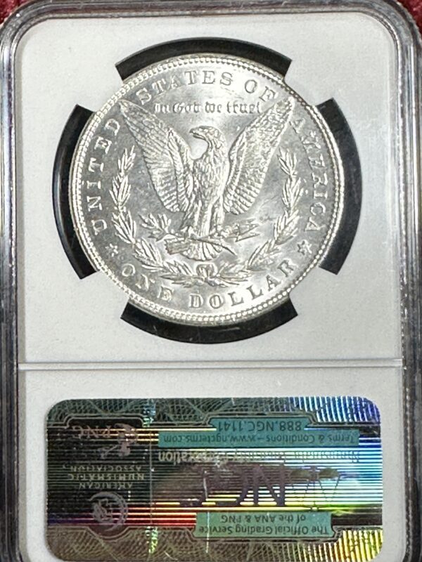 Extremely fine 1887 Morgan Dollar NGC MS63 displayed above a certificate of authenticity in a protective case.