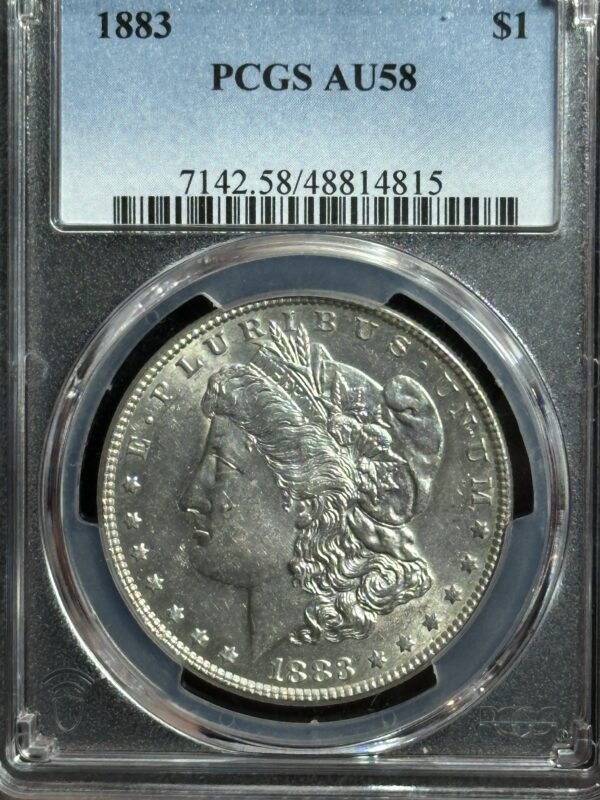 1883 Morgan silver dollar in a PCGS holder.