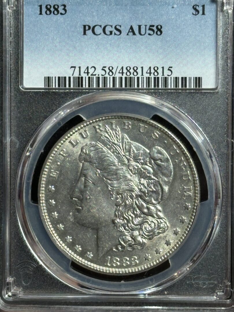 1883 Morgan silver dollar in a PCGS holder.