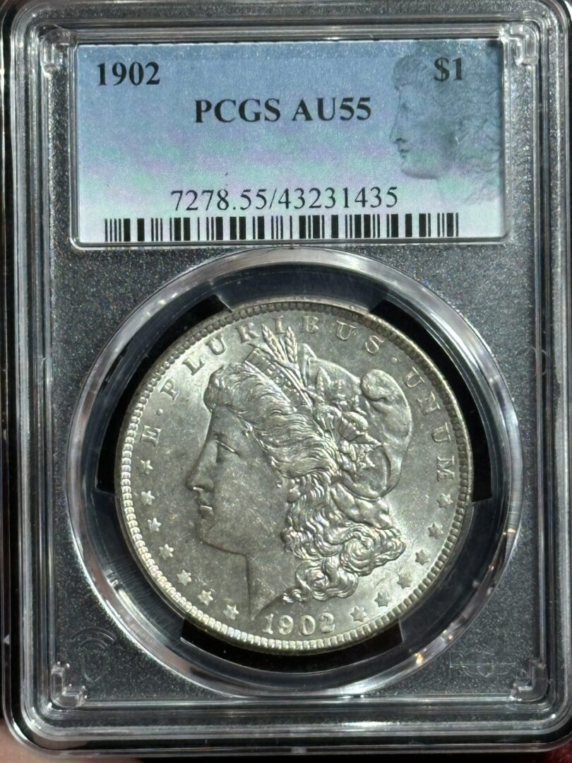 1902 Morgan silver dollar, AU55 grade.