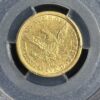 Gold coin with eagle and inscription "States of America".