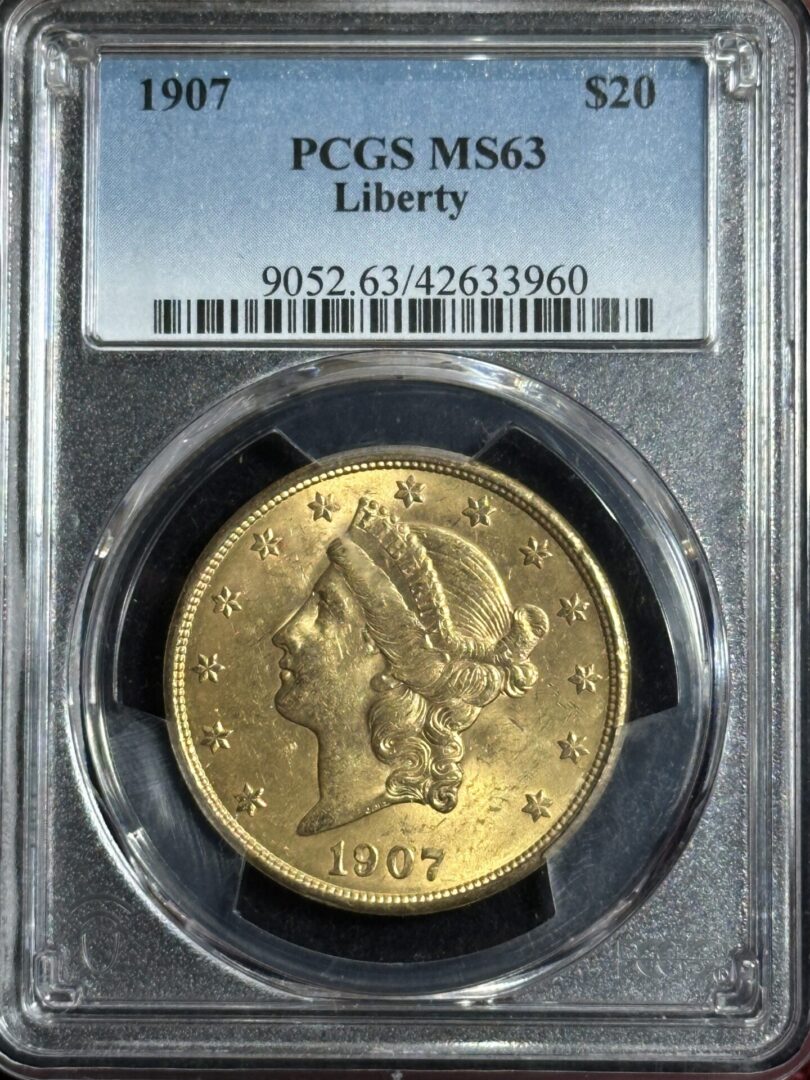 1907 $20 gold Liberty coin in a graded holder.