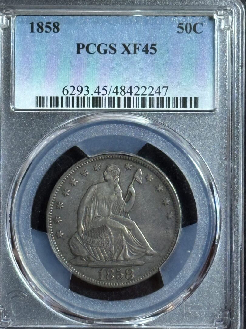 1858 seated liberty half dollar coin in holder.