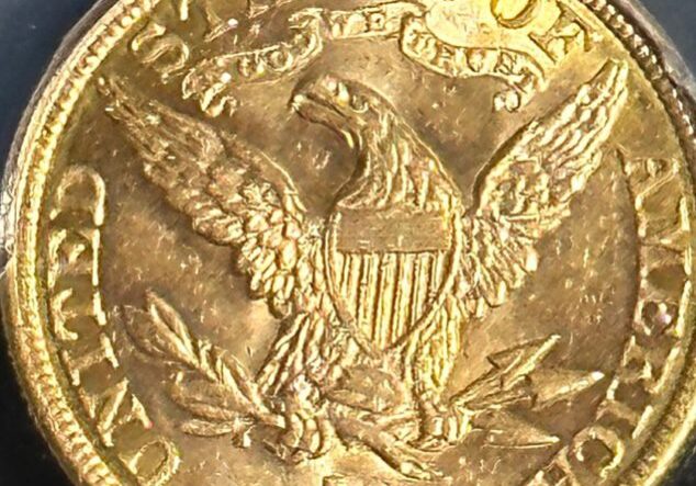 A gold coin with an eagle on it.